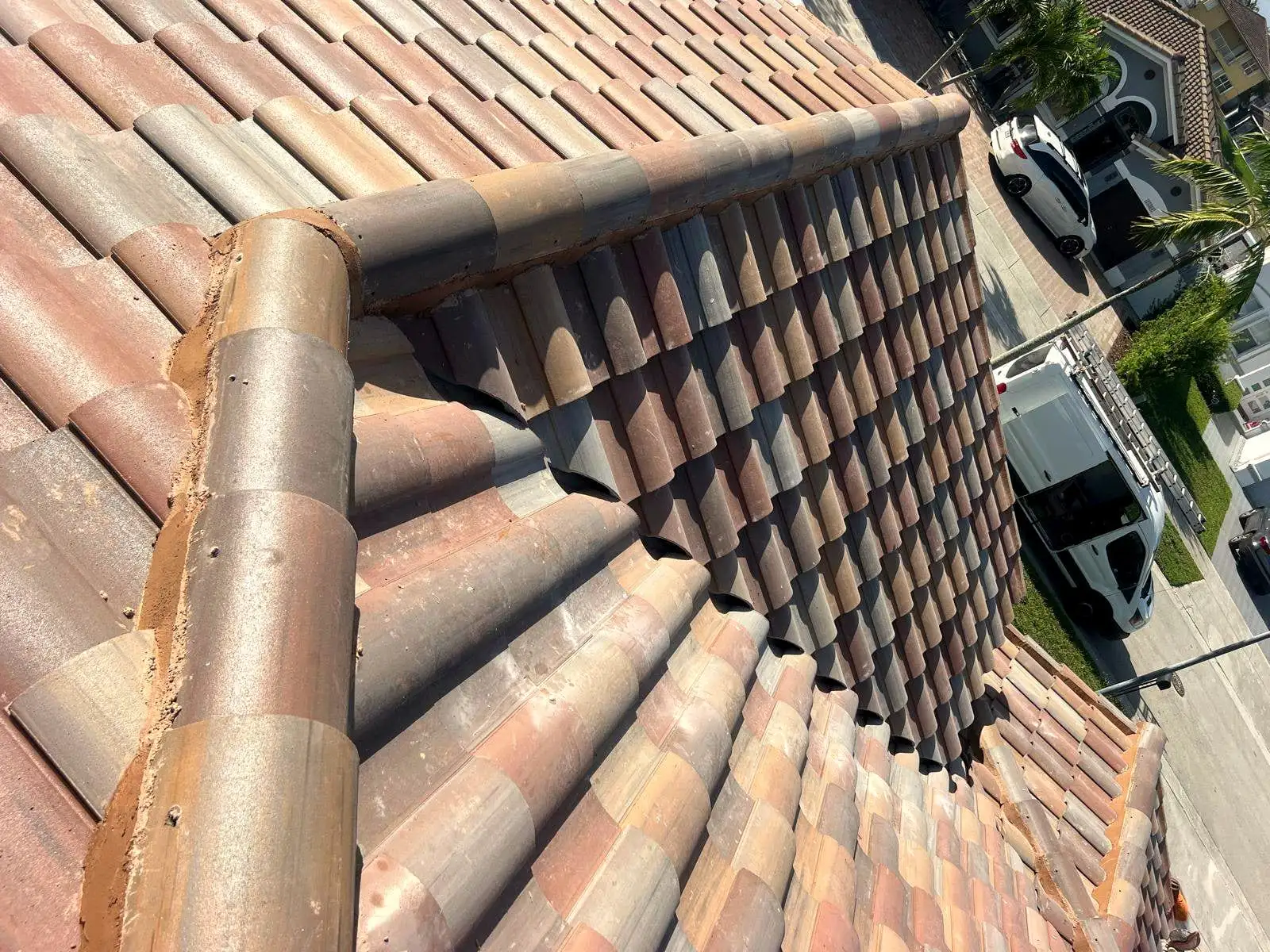 Clay barrel tile hip and ridge set in mortar