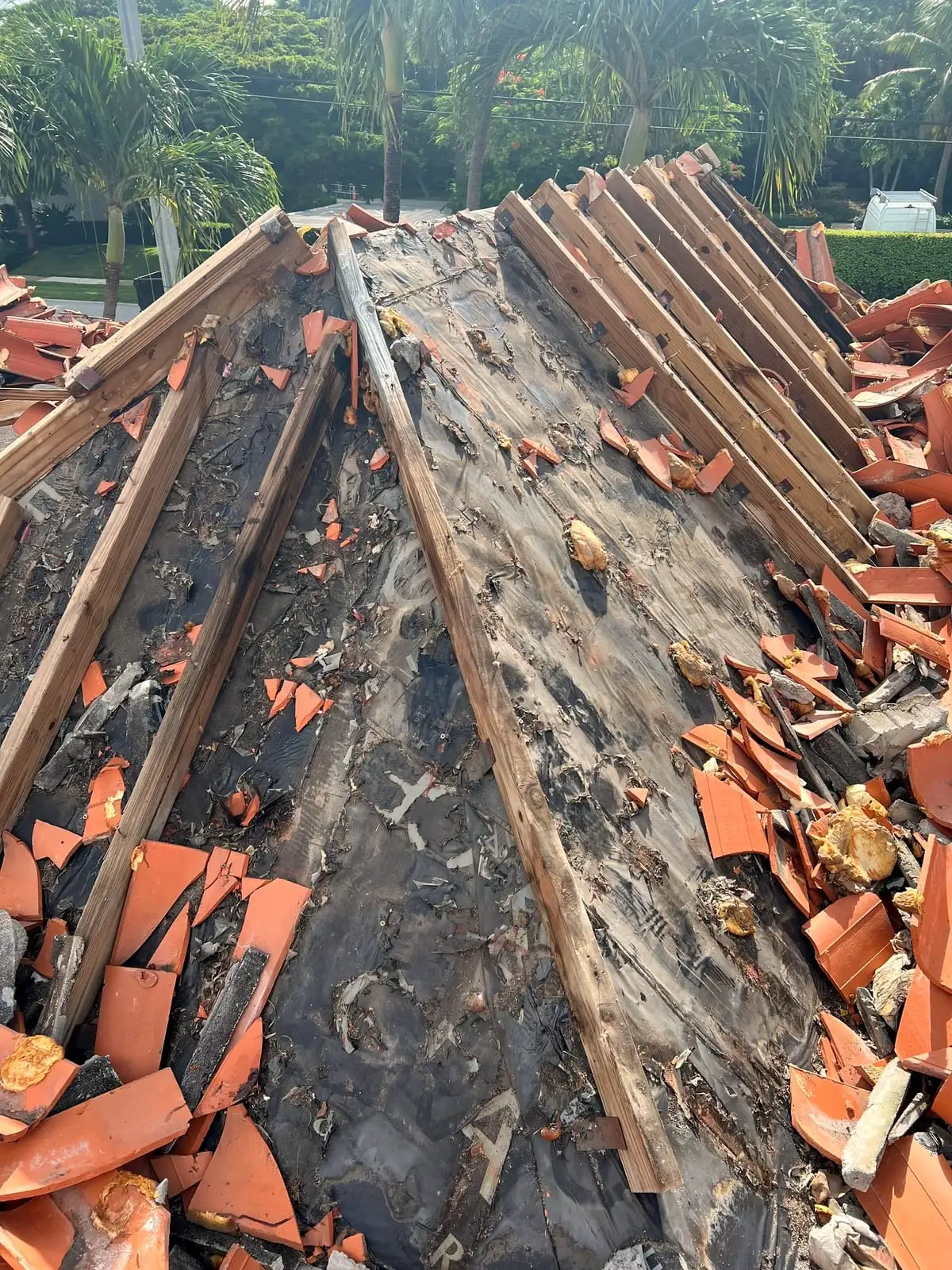 Clay tile roof opened down to the wood battens and the old underlayment